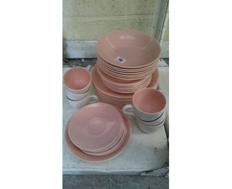 A Poole Pottery twin tone tea and dinner service decorated in a pink and grey glaze.
