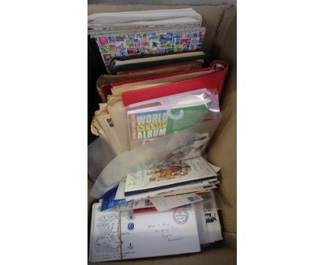 A box containing stamps, First Day Covers and other items.