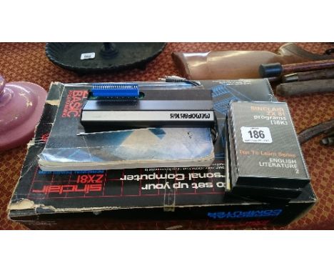 A Sinclair ZX81 personal computer in original box with three cassettes, programming instruction manual and other related item