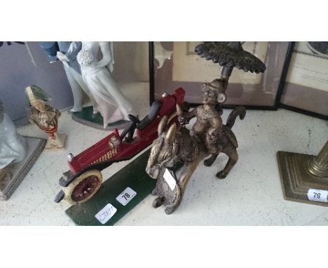 An Eastern brass model of a warrior on horse back together with a cold painted cast iron door stop modelled as a Vintage car.