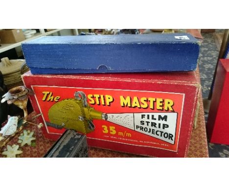 A Stip Master film projector and films.
