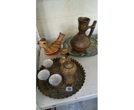The residue of an enamel decorated Moroccan brass coffee set comprising pot, lidded pedestal bowl, three cups with china line