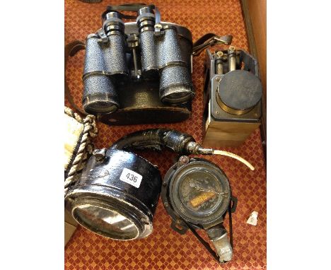 A black painted WWII morse code signal light together with a Clinc meter inspectors 45 degrees MK III admiralty pattern No.25