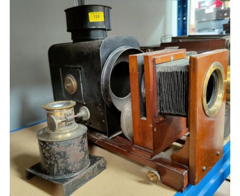 A mahogany, brass and japanned metal magic lantern with lens 