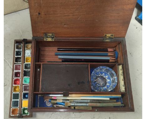 A 19th century artist's mahogany colour box, the ceramic palette marked Winsor and Newton, 23 cm 