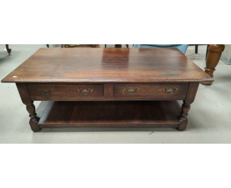 A large oak coffee table with 2 drawers, panelled under shelf, by Arighi Bianci, length 130cm x width 70cm x height 46cm 