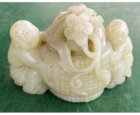 A Chinese jade coloured hardstone group of a young girl and boy with central basket of flowers length 8cm 