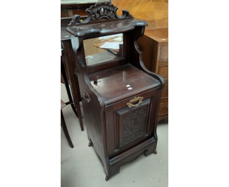 An Edwardian carved mahogany coal box, with fall front, mirror and shelf over 