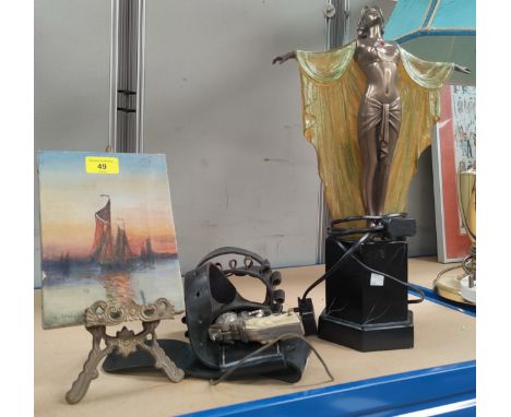 A small oil painting on brass easel; an Art Deco illuminated table lamp; a gun holster with toy gun 