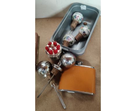A selection of 1920's and later alcohol related items including painted ceramic bottle stops, Art Deco measures etc 