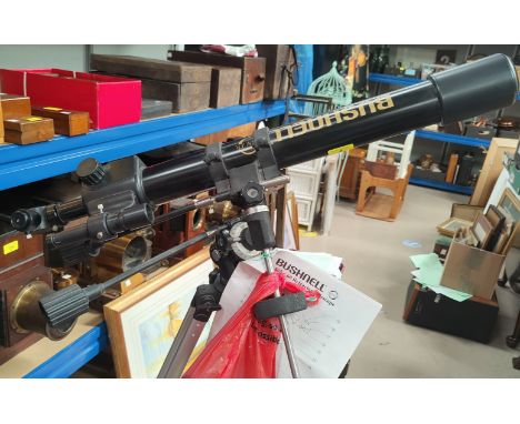 A Bushnell telescope on stand 