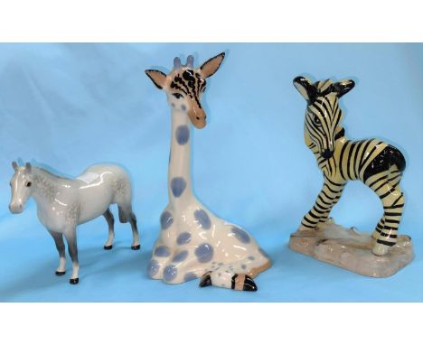 A Staffordshire Goldscheider pottery model of a zebra, 19 cm (head a.f.); a Studio Szeiler giraffe, 21 cm; a Beswick pony, le