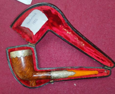 A 19th century briar pipe with silver mounts (dated 1883) and amber mouthpiece, cased 