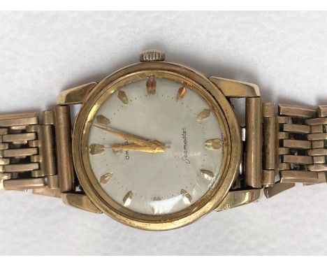 A vintage Omega Seamaster 17 jewel wristwatch with baton numerals and center seconds hand, no 15722445, gold plated and fitte