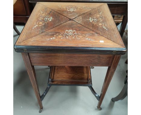 A Victorian Rosewood envelope card table with floral inlay to the top with satinwood inlay with later green baize, and a gall