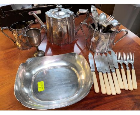 A rounded rectangular hallmarked silver dish, Sheffield 1943 and a silver plated tea service 