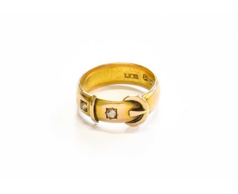 A 15 Carat Gold Diamond Buckle Ring, finger size PGross weight 3.4 grams.