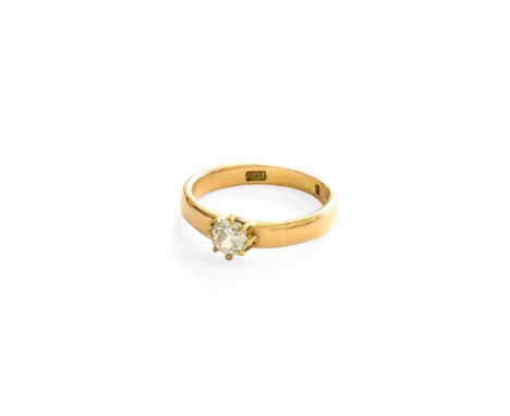 A Diamond Solitaire Ring, the old cut diamond in a yellow claw setting, to a plain polished shank, estimated diamond weight 0