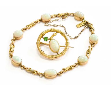 An Opal Bracelet, unmarked, length 17.8cm; and An Opal and Green Garnet Brooch, stamped '15', measures 2.3cm diameterBracelet