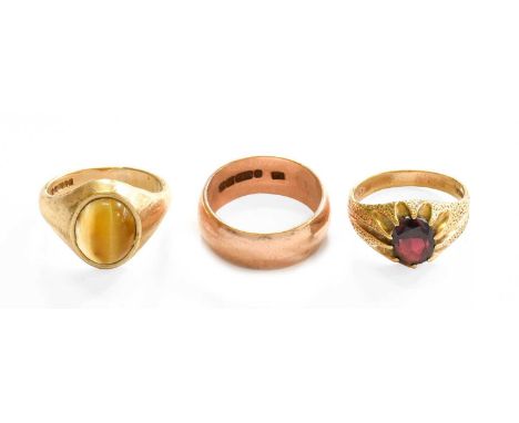 A 9 Carat Gold Band Ring, finger size R; A 9 Carat Gold Garnet Ring, finger size Q; and A 9 Carat Gold Tiger's-Eye Ring, fing