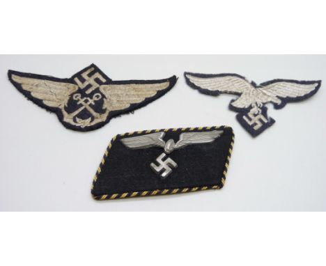 Three German WWII uniform patches, a German Reich Railway collar tab, a Luftwaffe patch and one other