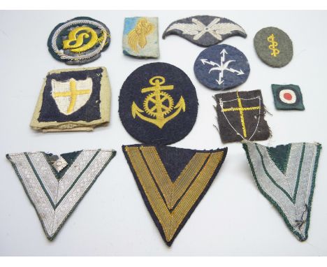 A collection of uniform patches, including Luftwaffe rank patch, other Luftwaffe, 8th Army patch and transport
