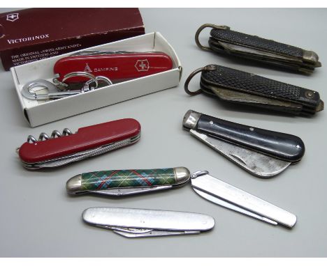 A collection of eight pocket knives including Victorinox and 1944 Richards Sheffield 