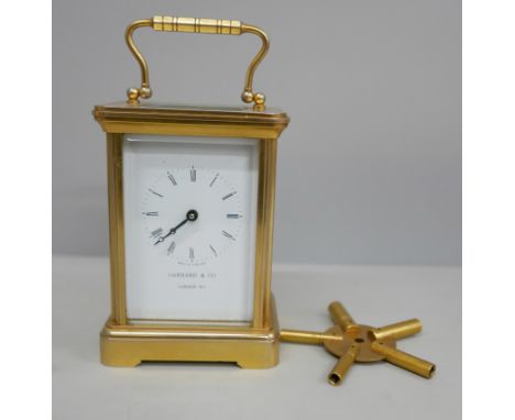 A Garrard and Co brass and four glass sided carriage clock with key 