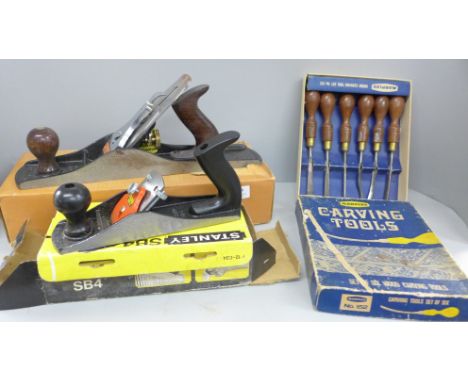 A Stanley SB4 wood plane, one other Stanley wood plane and a set of six Marples carving tools