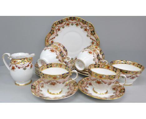 A Royal Tara Carina pattern 21 piece tea service, six cups, saucers, side plates, cream, sugar and cake plate