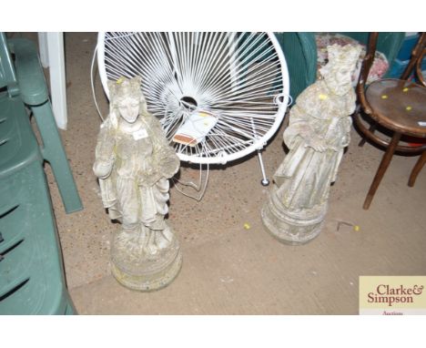 A pair of pre cast garden statues of a king and queen