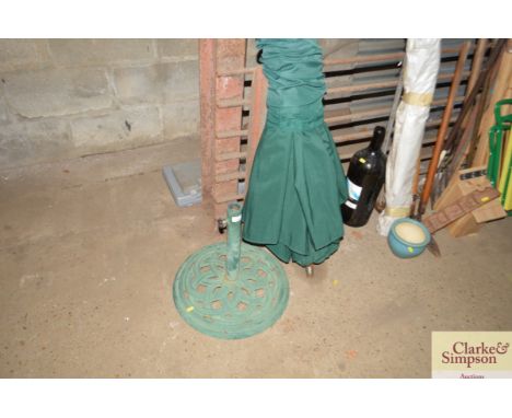 A garden umbrella and metal stand AF