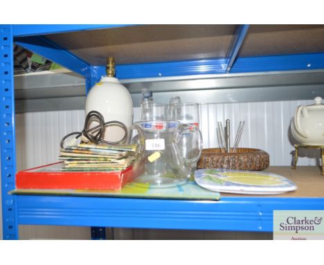 A quantity of decanters and stoppers, placemats, modern table lamp, collector card album etc 