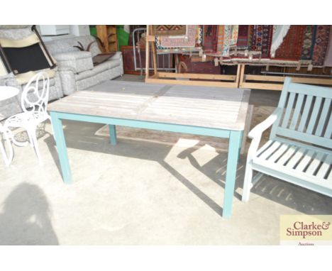 A teak and part painted slatted garden table 