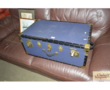 A brass bound travelling trunk