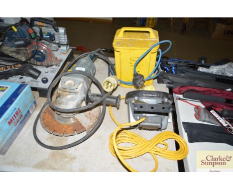 An angle grinder; a light and transformer