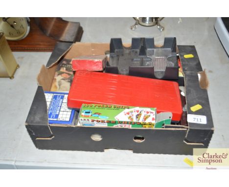 A box of various playing cards, draught pieces, travel chest board etc