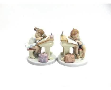 A PAIR OF LLADRO GROUPS 'WAITING FOR THE BELL' AND 'SLEEPY SCHOLAR'  each approx 16cm high, complete with boxes