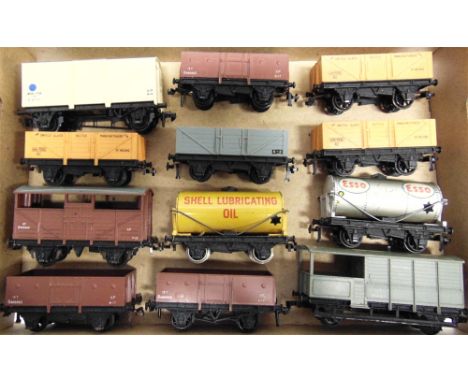 [OO GAUGE]. TWELVE HORNBY DUBLO WAGONS  comprising a fish van (blue spot); three brown steel open wagons; a tank wagon 'Esso'