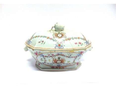 A CHINESE EXPORT ARMORIAL TUREEN AND COVER  with boars head handles and fruit finial, decorated with a crest and the motto 'A