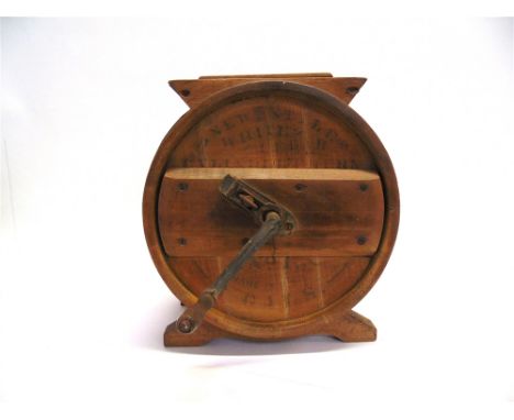 A METAL BOUND PINE BUTTER CHURN  of cylindrical form, with rotary handle, 39cm high
