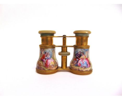 A PAIR OF ENAMEL OPERA GLASSES each draw with a young 18th century couple with sheep to an architectural background, stamped 