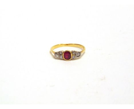 A RUBY AND DIAMOND RING unmarked, the oval cut ruby, approximately 4.5mm by 3.99mm by 3.6mm deep, with a trio of single cut d