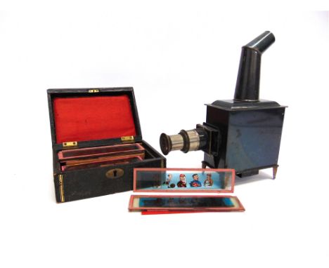 A GERMAN TINPLATE CHILD'S MAGIC LANTERN  together with approximately fifty-four colour-printed strip slides.