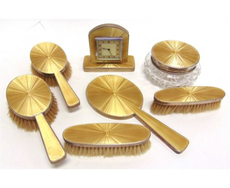 A SILVER AND ENAMEL DRESSING TABLE SET in a golden brown guilloche finish, by Collett & Anderson, London 1937, comprising a b