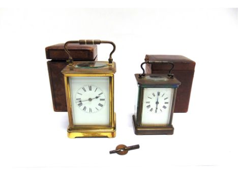 EDWARDIAN BRASS CASED CARRIAGE CLOCKstriking the hours on a coiled gong, presentation inscription to top, with an associated 