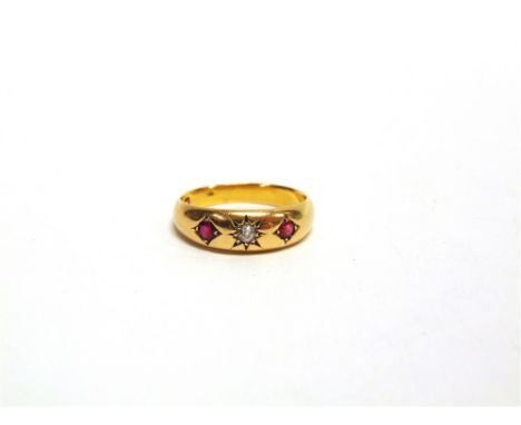 A LATE VICTORIAN THREE STONE RUBY AND DIAMOND GYPSY RING Chester 1895, the central star set old brilliant cut of approximatel