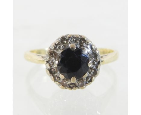 An 18 carat gold sapphire and diamond cluster ring, boxed