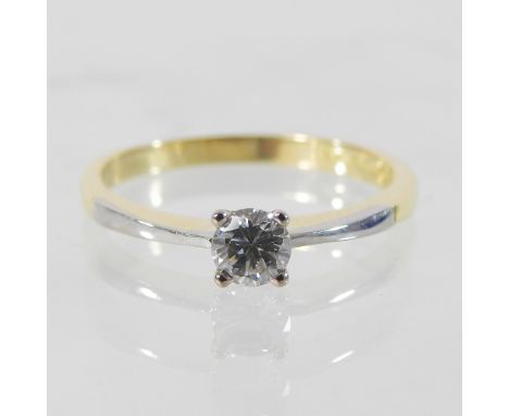 A bespoke 18 carat gold solitaire diamond ring, with platinum shoulders approximately 0.4 carats, boxed, with receipt