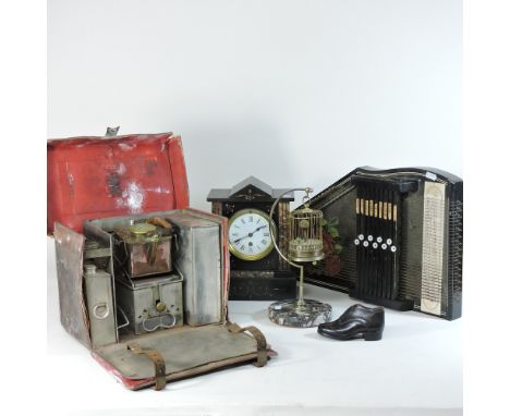 An early 20th century travelling stove set, with kettle, reg no 455744 in a leather case, bearing maker's name Finnegans of N